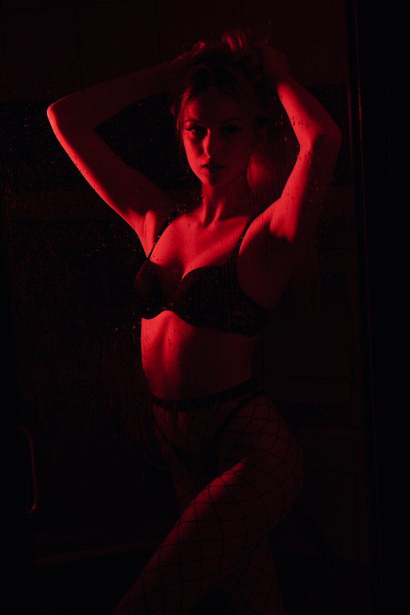 Photo by Brian Lawson woman in black brassiere and white pants